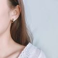 Elegant silver butterfly hoop earrings with a textured matte finish shown on model - Matte Butterfly Ear Buckle (HL-14)
