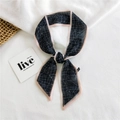 Narrow silk scarf with black white grid pattern and pink border tied in a knot - Chiffon Grid Line Black