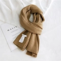 Thick ribbed knit scarf in camel brown with a white label for autumn and winter warmth - Camel