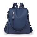 Deep blue PU leather backpack with lychee texture and front zipper on white background - Blue