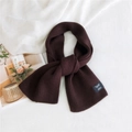 Dark brown ribbed knit scarf with decorative label and soft warm winter texture - Dark Brown