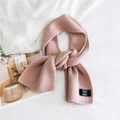Solid color double-sided knitted scarf in dusty rose pink with stylish fabric label - Pink