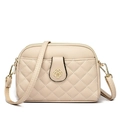 Beige litchi grain crossbody bag featuring quilted rhombus pockets and a gold floral lock - Apricot