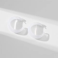 Macro detail of white translucent resin C-shaped hoop earrings with silver metal posts - Transparent (Glossy)