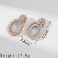 Handmade bohemian seed bead oval earrings in light pink with size and weight info - Khaki