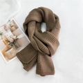 Thick brown knitted winter scarf for women featuring a cozy ribbed texture and long design - Camel