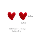 Detail view of red flocked heart earrings showing material texture and 2.6cm size - Red