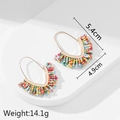 Handmade beaded V-shape fringe earrings with colorful tribal pattern and size specs - Colorful