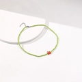 Detailed shot of green bead choker with orange starfish pendant and silver clasp - Light Green