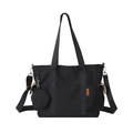 Large black canvas tote bag with adjustable shoulder strap and a small coin purse charm - Black