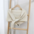Elegant cream knitted triangle shawl featuring a ribbed texture and tie-up design for women - Off-white