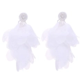 Detail of white handmade fabric tassel earrings with layered chiffon petals and beadwork - White