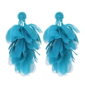 Close-up of bohemian blue fabric petal tassel earrings with beaded round base details - Blue
