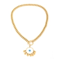Detail of gold evil eye necklace with tassel charms and vintage OT toggle clasp - Necklace