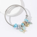 Adjustable stainless steel wire bracelet with blue butterfly charm and LOVE pendant - Blue