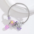 Stainless steel wire bracelet with purple dragonfly charms and pink crystal leaf pendants - Purple