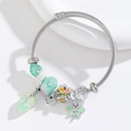 Adjustable stainless steel wire bracelet with dragonfly charms and green floral beads - Green