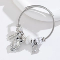 Adjustable stainless steel cable bracelet with owl and heart charms and pearl beads - White
