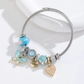 Adjustable stainless steel charm bracelet with blue butterfly and heart pendants - Macaron Blue