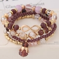 Set de 4 pulseras de cuentas moradas con dije de infinito en oro rosa y colgante de corona - Morado