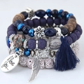 Bohemian multilayer beaded bracelet with blue crystals, tassels, and heart charm - Blue