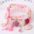 Set de pulseras multicapa rosa con lazo, colgante de concha y cristales de estilo bohemio - Rosa