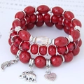 Bohemian multilayer beaded bracelet set with red crystal beads and silver elephant wing charms - Red