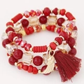 Meerlaagse rode kristallen kralenarmband met gouden vleugel hanger en franje kwastje - Rood