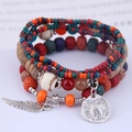 Bohemian multilayer beaded bracelet with feather and Eiffel Tower charms in vintage style - Colorful