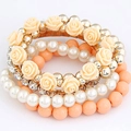 Pulsera elástica multicapa bohemia con rosa de resina, perlas y cuentas melocotón - Naranja