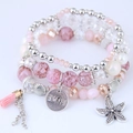 Bracelet bohème multicouche avec perles roses, étoile de mer et pendentif à franges - Rose