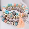 Bohemian multilayer beaded bracelet set with Hamsa hand charm and orange tassel - Colorful