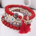 Bohemian multi-layer beaded bracelet with Hamsa Hand charm and red silk tassel - Red