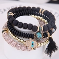 Bohemian multi-layer bracelet set with Hamsa Hand, lava stones, and black silk tassel - Black