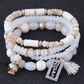 Bohemian multi-layer beaded bracelet with champagne crystal beads and happy tassel charm - White