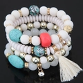 Set di bracciali bohémien multistrato con perle bianche, turchese e dettaglio nappa - Bianco