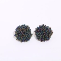 Macro shot of handmade iridescent glass bead cluster earrings with colorful metallic finish - AB Color