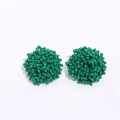 Detail shot of green handmade beaded stud earrings with intricate spherical beadwork - Green