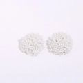 Detail of white handmade beaded ball stud earrings with intricate woven seed bead texture - White