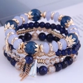 Bohemian multi-layer beaded bracelet with blue stone beads and metal tassels - Navy Blue