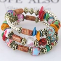 Bracciale elastico multistrato bohémien con perline di legno e ciondoli floreali - Colorato