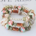 Bracciale multistrato bohémien con perline di ceramica e conchiglie naturali - Bianco