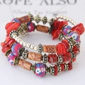 Bohemian multilayer beaded bracelet with red stone beads and vintage floral ceramic accents - Red