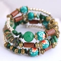 Bohemian multilayer beaded wrap bracelet with turquoise, wood, and vintage metal accents - Green