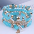 Bohemian multilayer beaded bracelet set with blue crystals and gold crown charms - Light Blue