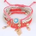 Bracciale bohémien multistrato con perline, occhio di Allah, mano di Fatima e cuori - Rosso