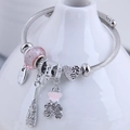 Silver twisted cable bracelet with pink charms, sparkling bear and handmade tag detail - Pink