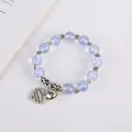 Bracciale stile bohémien con perline azzurre, distanziatore a girasole e ciondolo a cuore - Blu