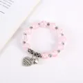 Detail of pink cracked crystal bracelet with sunflower spacers and Eternal Love heart charm - Pink