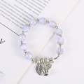 Bracciale di perle di cristallo viola con ciondoli in argento a foglia e corona - Blu